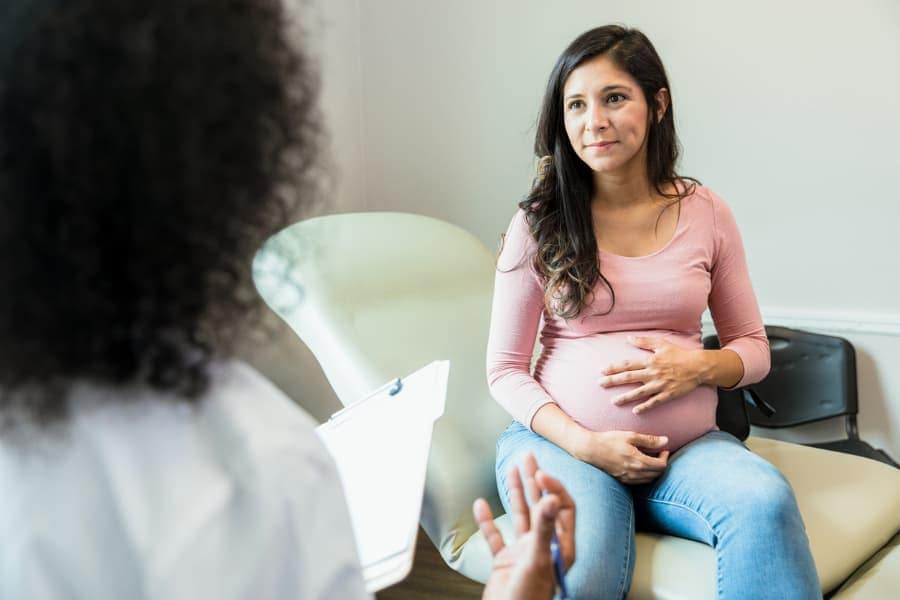 Expecting mother talking to physician