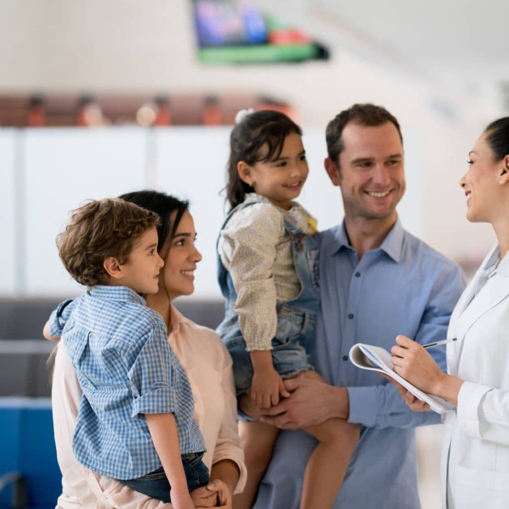 Physician talking to family at hospital