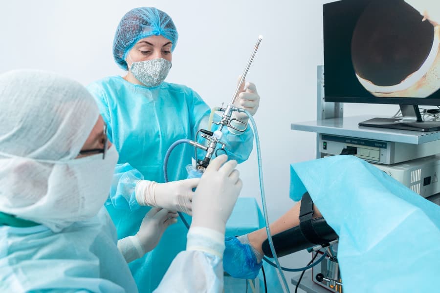Gynecologist holding gyroscope during surgery in operating room