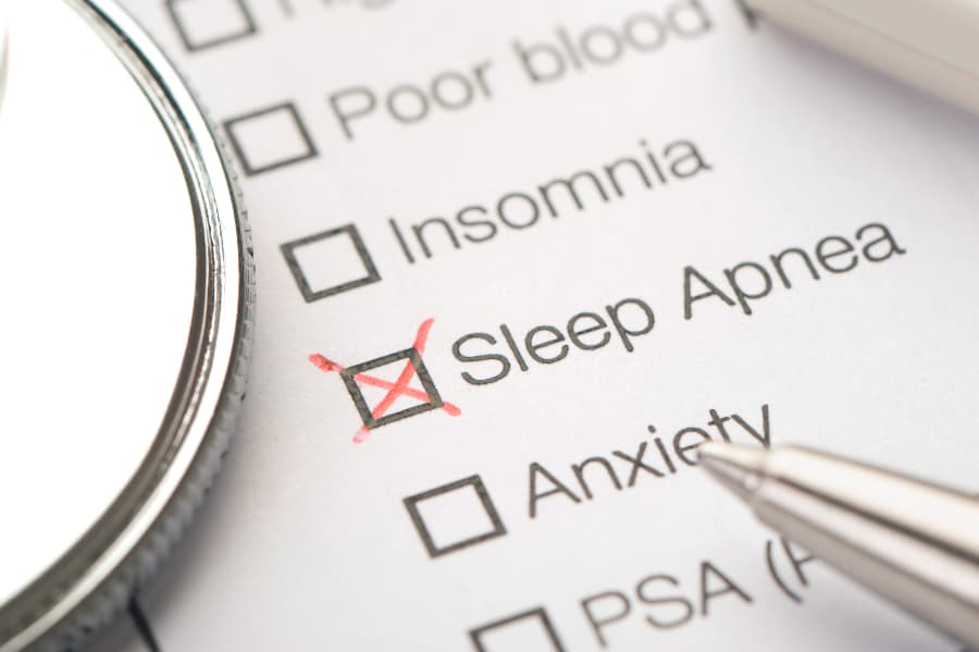 Paper with medical conditions with sleep apnea checked off in red